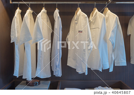 row of white shirts on rail row of white shirts on rail 40645807
