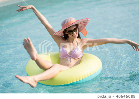 Woman in bikini on green air inflatable ring. Woman in bikini on green air inflatable ring. 40646089