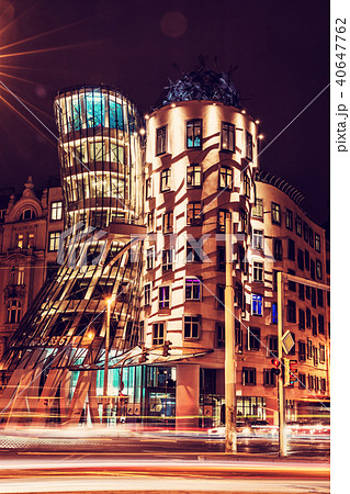 Dancing house with traffic in Prague, red filter Dancing house with traffic in Prague, red filter 40647762