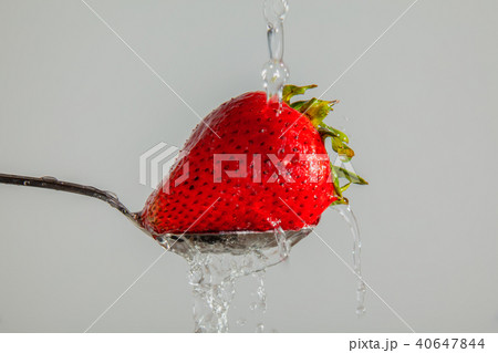 Washing a Strawberry 40647844