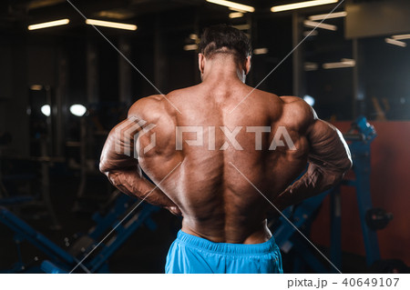 Handsome model muscle man abs workout in gym Handsome model muscle man abs workout in gym 40649107