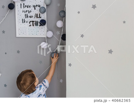 boy reaches garland inscription  I love you 40662365