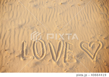 big text LOVE in the sand of the beach 40664419