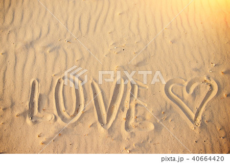 big text LOVE in the sand of the beach big text LOVE in the sand of the beach 40664420