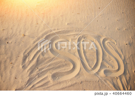 The inscription on the sand beach SOS The inscription on the sand beach SOS 40664460