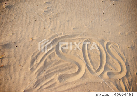 The inscription on the sand beach SOS The inscription on the sand beach SOS 40664461