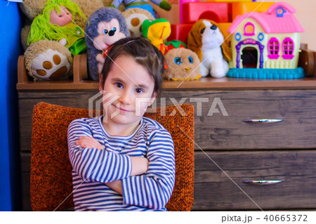 cute girl on the background of her toys smiling 40665372