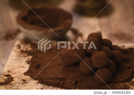 craft chocolate truffles on wooden board with cocoa powder craft chocolate truffles on wooden board with cocoa powder 40668280