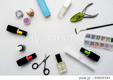 Bottles of nail polish on a colorful wooden table 40669394