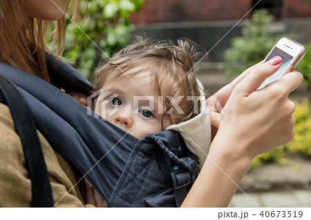 little baby in carrier with mother at outdoor 40673519