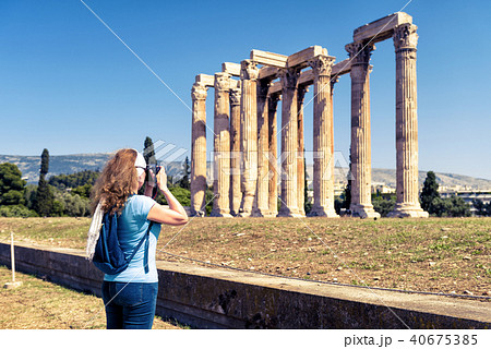Woman photographs the Temple of Olympian Zeus 40675385