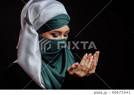 close up side view shot of Islamic woman with closed eyes has converted to Islam 40675441