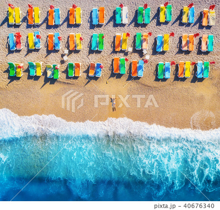 Aerial view of lying woman on the beach Aerial view of lying woman on the beach 40676340