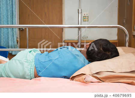 little boy sick sleep on patient  bed 40679695