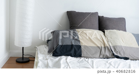 sunlight Bed maid-up with clean white pillows and  40682816