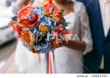 bright and juicy color Wedding bouquet different flowers. Modern bridal bunch with orange tulips 40685764