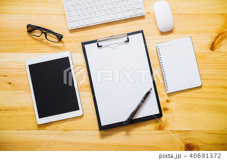 Office desk table with computer, supplies, laptop Office desk table with computer, supplies, laptop 40691372