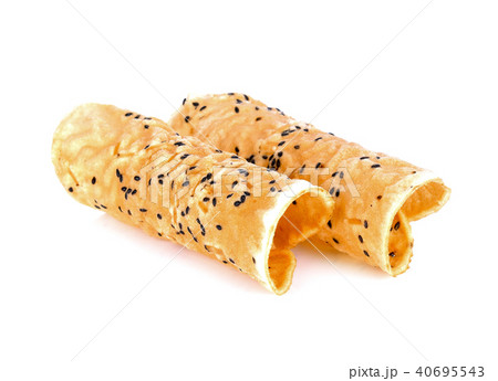 Black sesame chips on white background Black sesame chips on white background 40695543