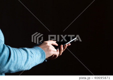 Person's hands using a smartphone Person's hands using a smartphone 40695871