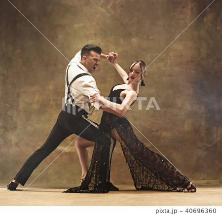 Flexible young modern dance couple posing in studio. Flexible young modern dance couple posing in studio. 40696360