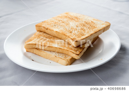 Stack of toasted bread on white dish background 40698686
