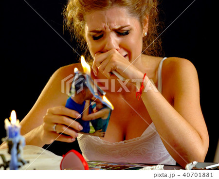 Broken heart woman. Couple break up. Burning family photo. 40701881