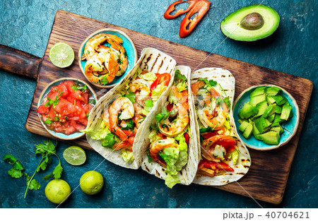 Shrimps tacos with salsa, vegetables and avocado. Mexican food 40704621