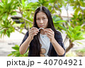 Young beautiful woman holding broken cigarette 40704921