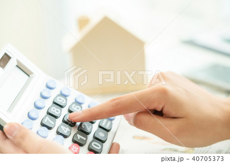 Woman accountant or bank worker uses calculator. 40705373