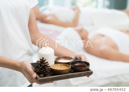 Massage therapist with hot spa treatment set. 40705452