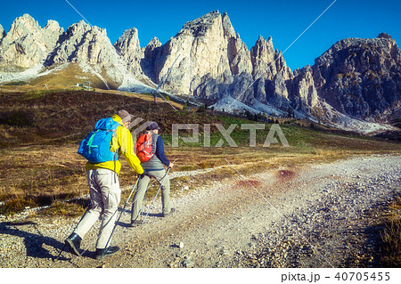 Travelers hike breathtaking landscape of Dolomites 40705455