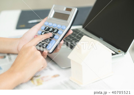 Woman accountant or bank worker uses calculator. 40705521