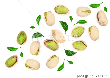 Pistachios with leaves isolated on white background with copy space for your text, top view. Flat 40713123