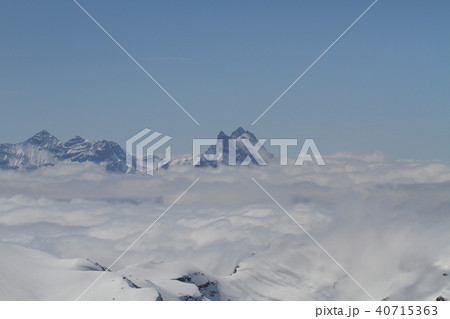 ice mountains peak middle clouds clear blue bright 40715363