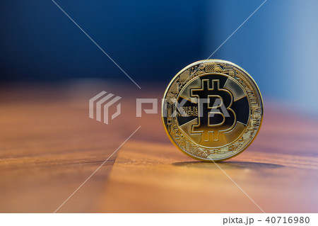 Cryptocurrency sign silver Bitcoin blue background 40716980