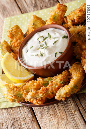 Fried avocado in breaded panko with spicy sauce Fried avocado in breaded panko with spicy sauce 40717891