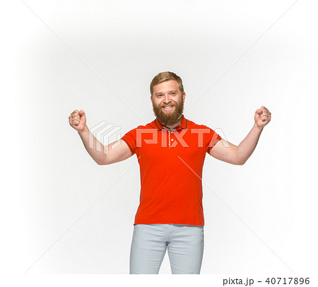 Closeup of young man's body in empty red t-shirt isolated on white background. Mock up for disign 40717896