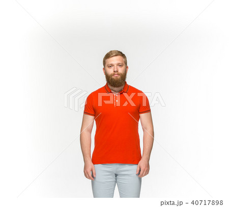 Closeup of young man's body in empty red t-shirt isolated on white background. Mock up for disign Closeup of young man's body in empty red t-shirt isolated on white background. Mock up for disign 40717898