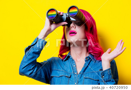 girl in blue shirt holding binoculars with rainbow girl in blue shirt holding binoculars with rainbow 40720950