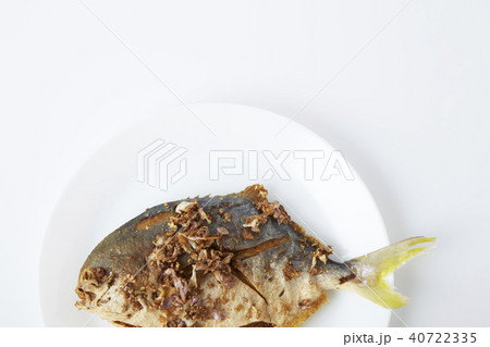Fresh pomfret deep fried in dish Fresh pomfret deep fried in dish 40722335