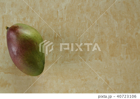 green mango on yellow marble background green mango on yellow marble background 40723106
