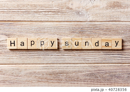 Happy sunday word written on wood block. Happy sunday word written on wood block. 40728356