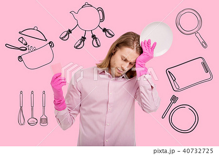 Portrait of upset housewife man washing dishes 40732725
