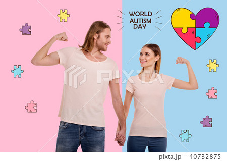 Cheerful parents looking confident on the World autism day Cheerful parents looking confident on the World autism day 40732875