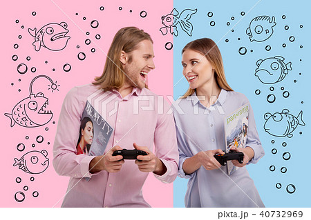 Loving couple looking at each other while winning a video game Loving couple looking at each other while winning a video game 40732969