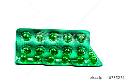 Green round soft capsule pills isolated on white 40735271