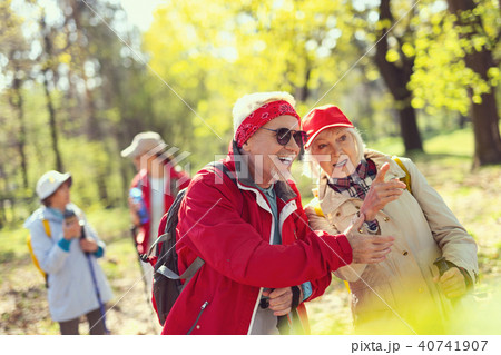 Cheerful man and woman looking at a bird 40741907