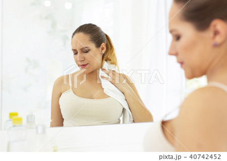 Worried dull woman experiencing heat Worried dull woman experiencing heat 40742452