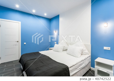Hotel standart room. modern bedroom with white pillows. simple and stylish interior. interior Hotel standart room. modern bedroom with white pillows. simple and stylish interior. interior 40742522