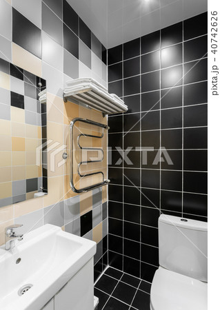 Bathroom with shower, toilet bowl and sink. Hotel standart bedroom. simple and stylish interior 40742626